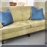 F17. Ultrasuede loveseat with nailhead trim. 36”h x 77”w x 38”d 